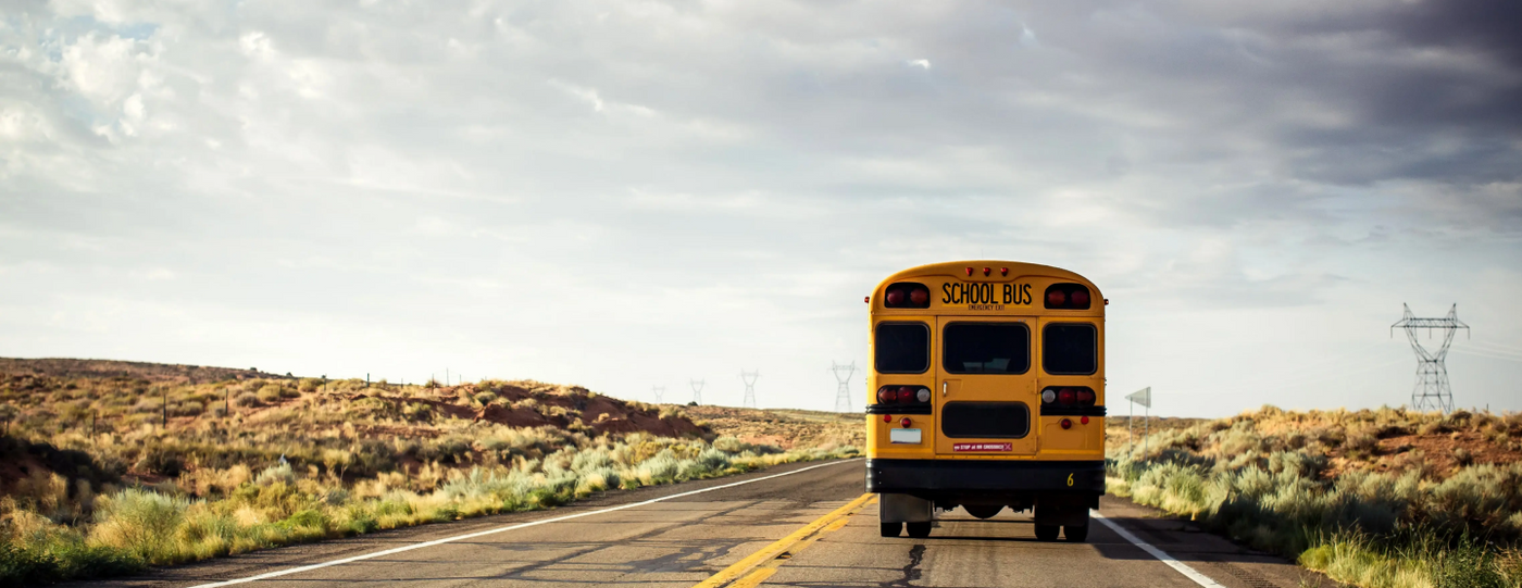 A Bus Driving on the Road